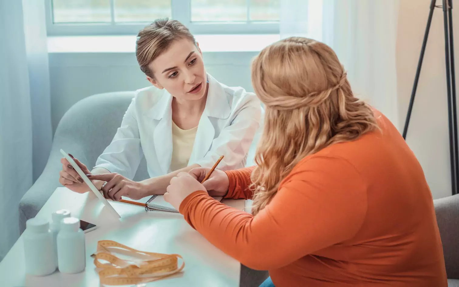 a person talking to a doctor