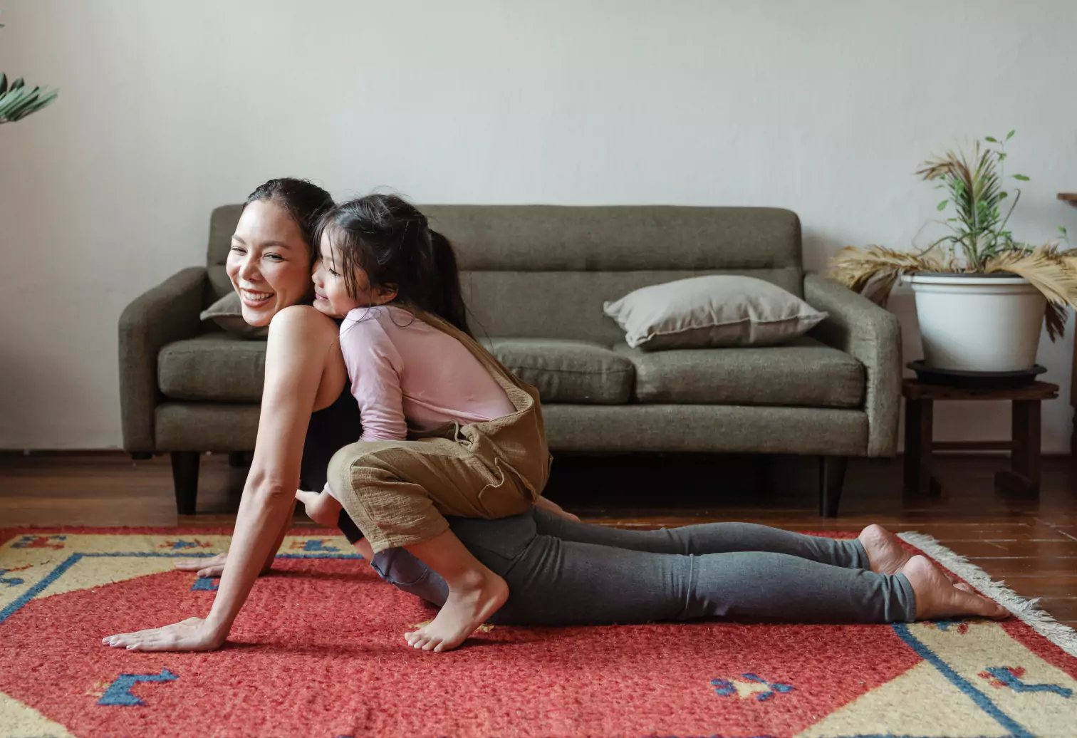 mom and daughter doing yoga