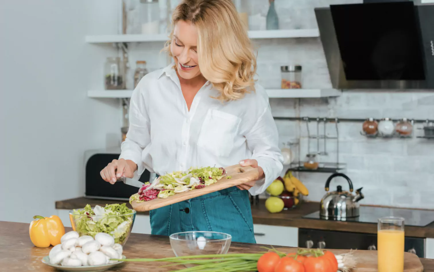 a person maing a salad