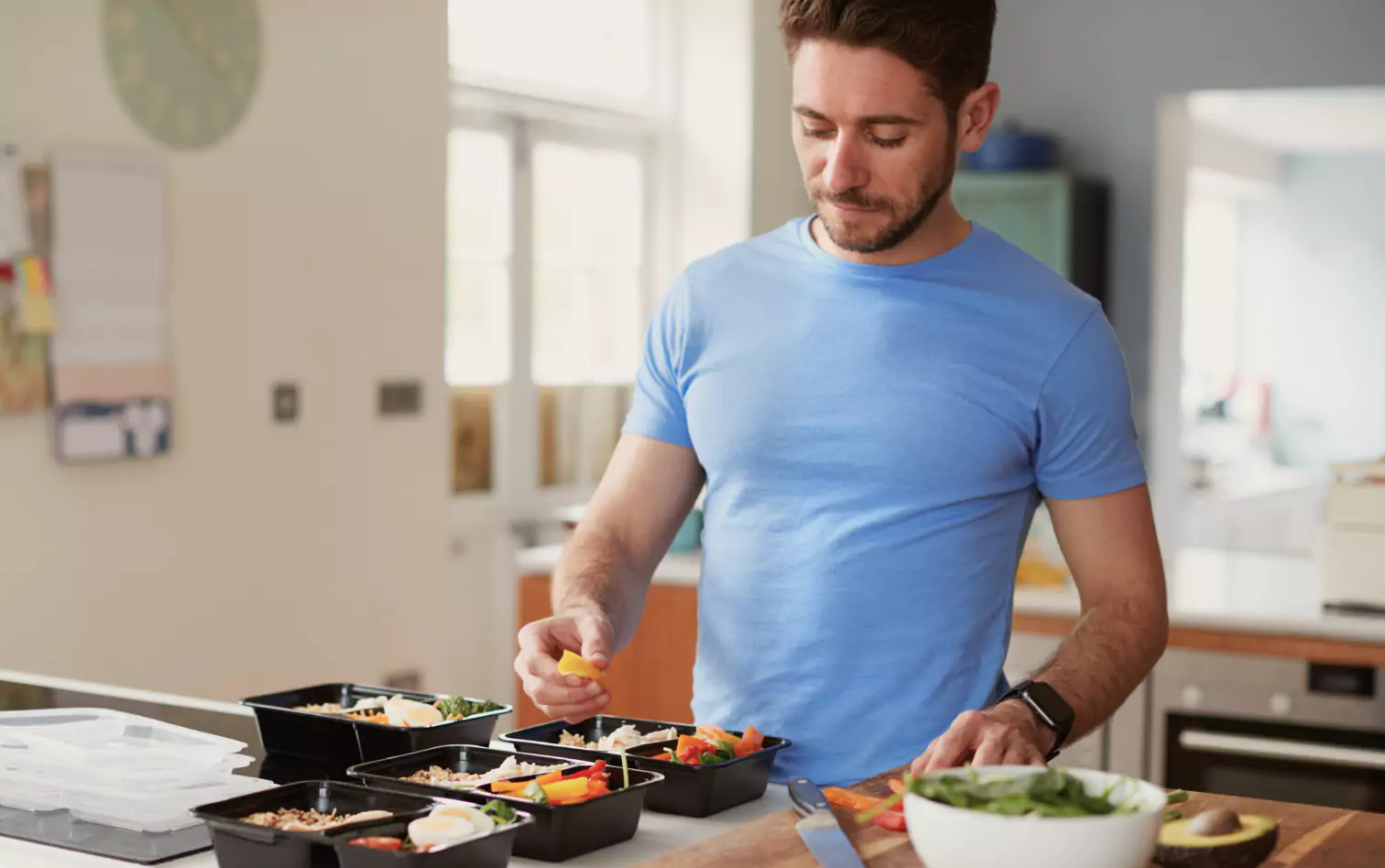 a person preparing lunchboxes 