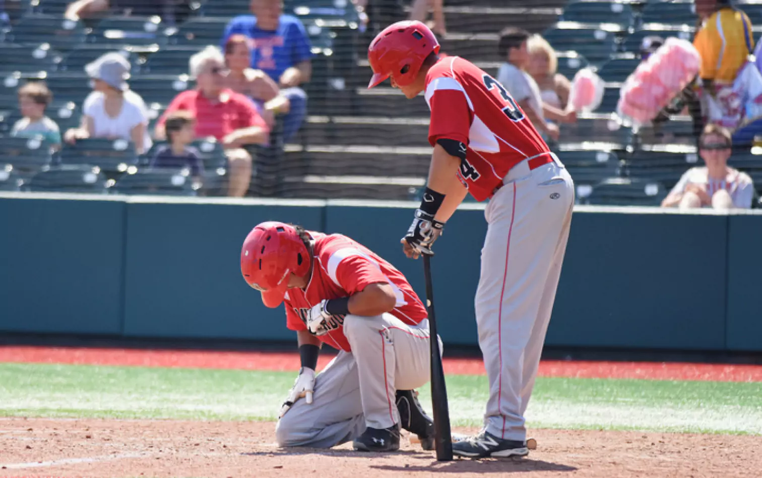 one of two baseball players being injured 