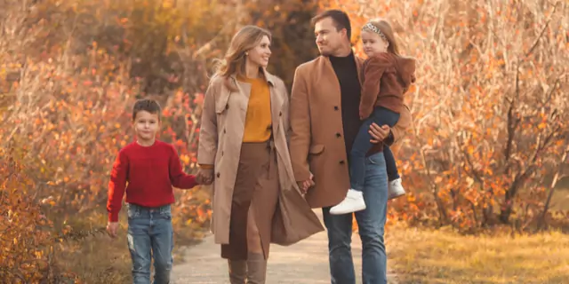 a family of four walking