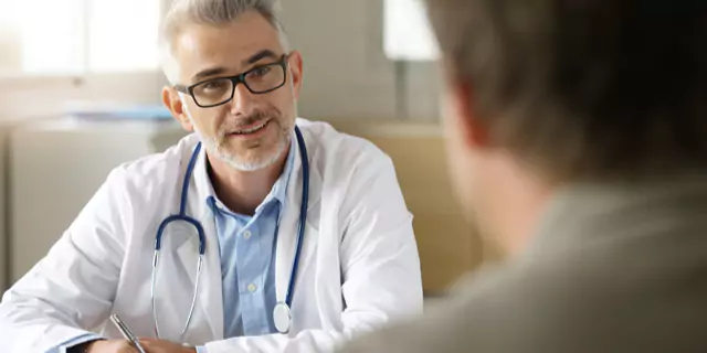 a doctor talking to a patient 