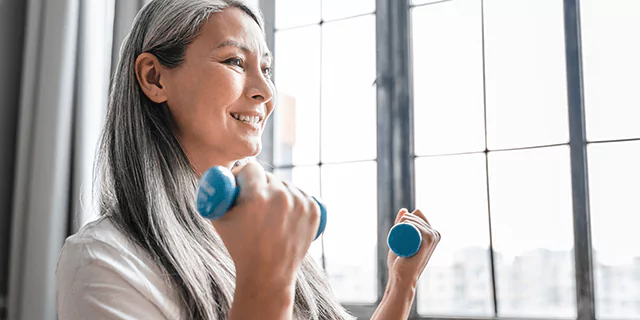 a person holding dumbbells