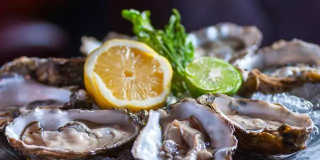 oysters and a half of a lemon