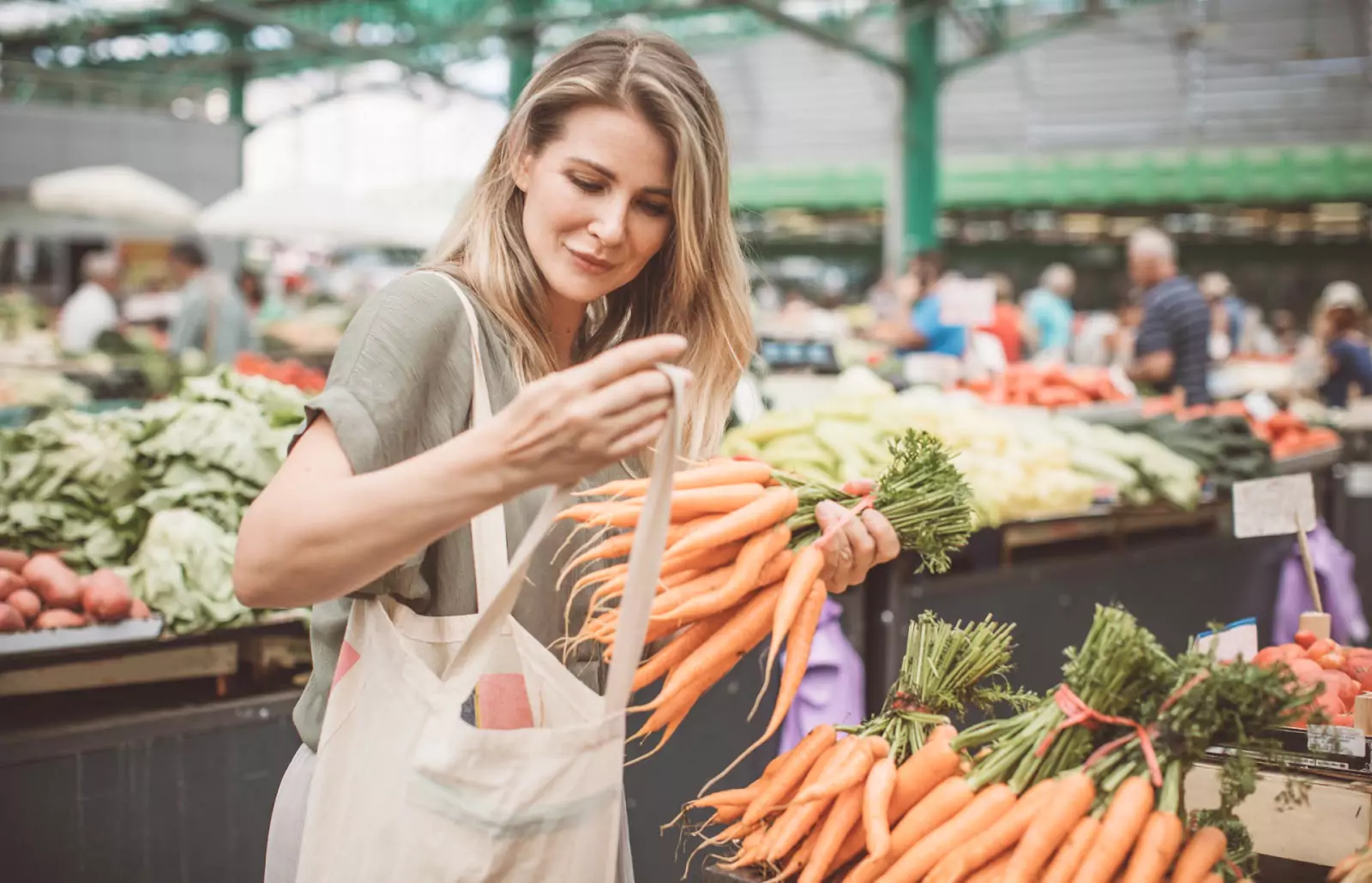 a person picking carrots 