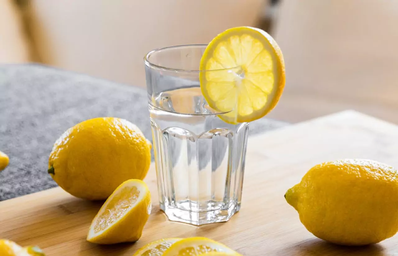 lemons and  glass of water with lemon 