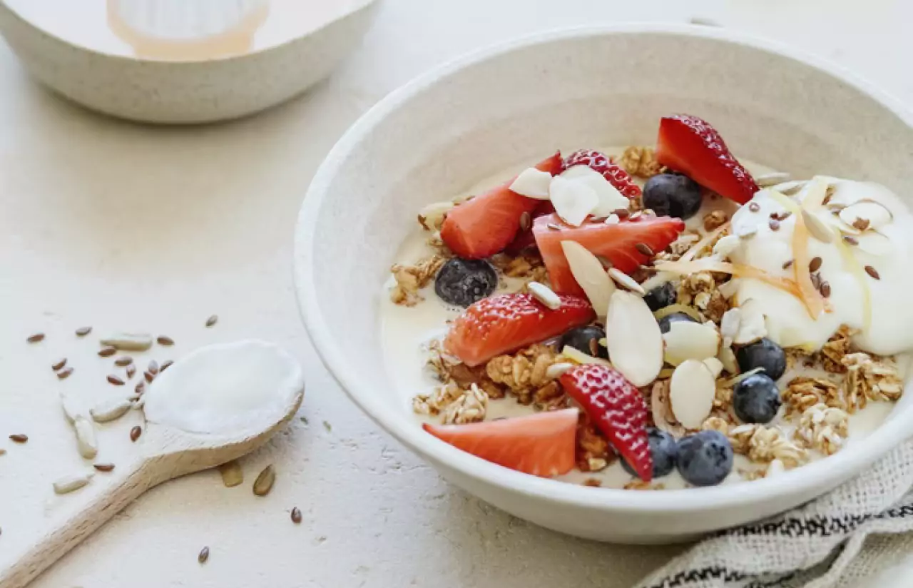 a bowl of oatmeal, berries and yogurt 