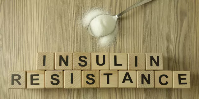 a spoon of sugar and dices spelling insulin resistance 