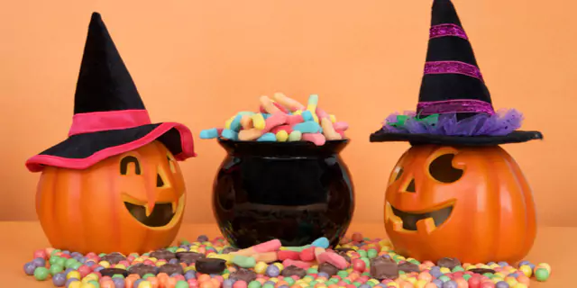 jack o lantern and a jar of candies 