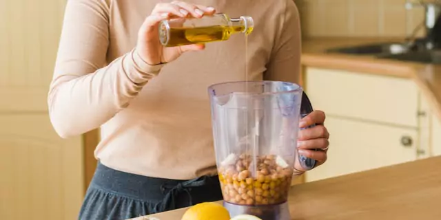 a person making hummus