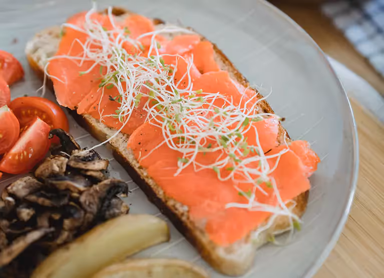 a plate of salmon toast