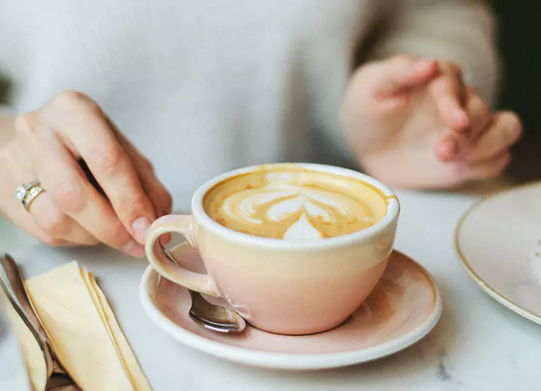 Table with latte at a cafe