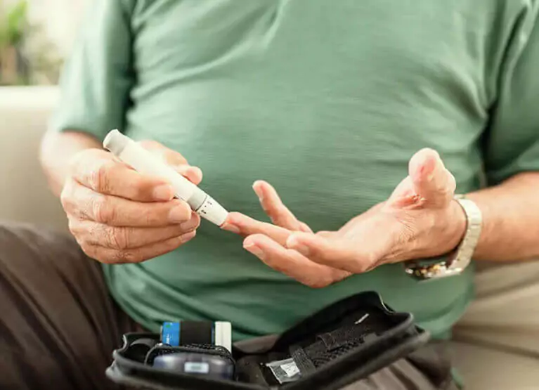 someone taking their blood sugar with a finger prick