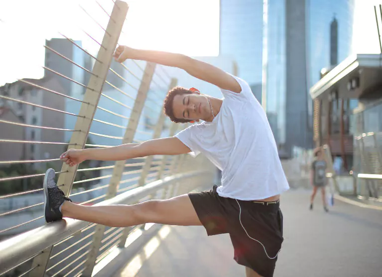 Person doing a PNF stretch on a bridge