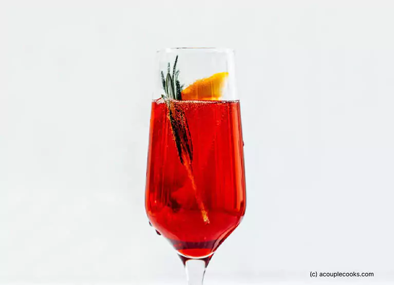 a glass of pomegranate mimosa