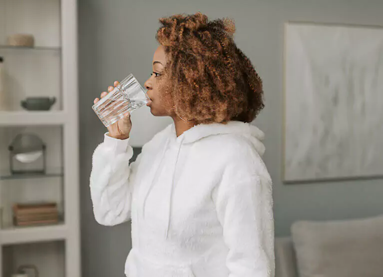 a woman drinking water