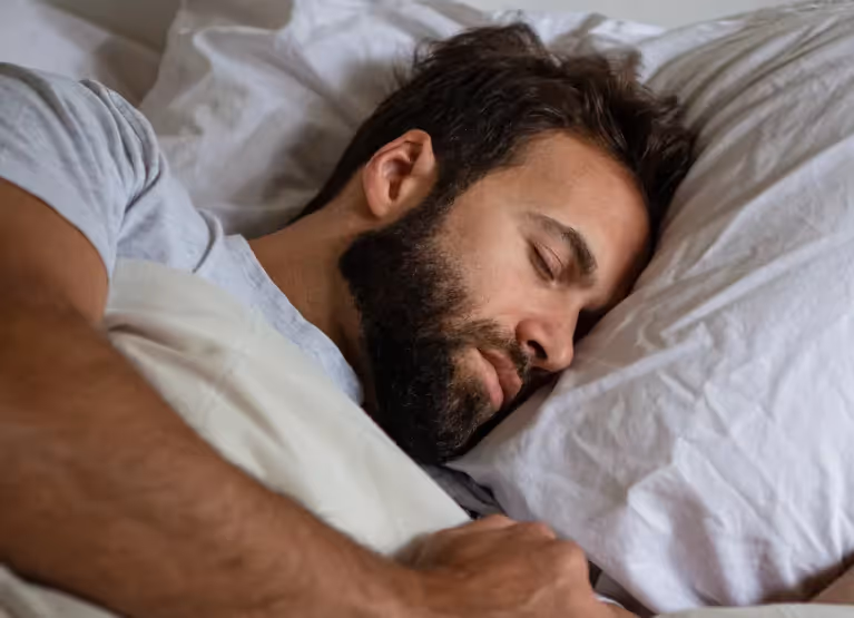 a man sleeping in bed