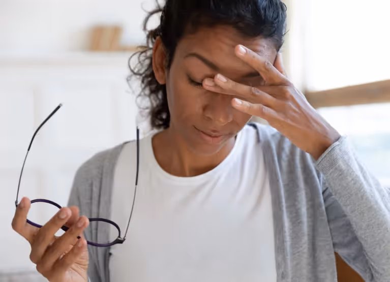 a woman feeling dizzy