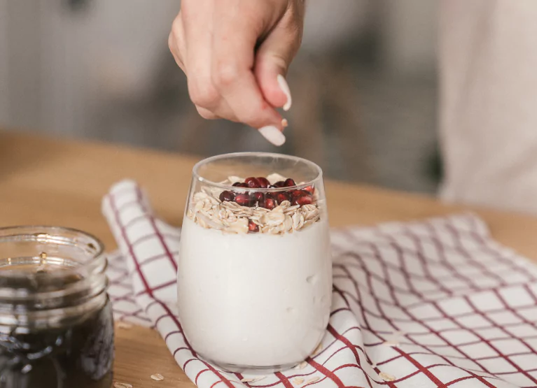 Yogurt bowl with granola and pomegranates