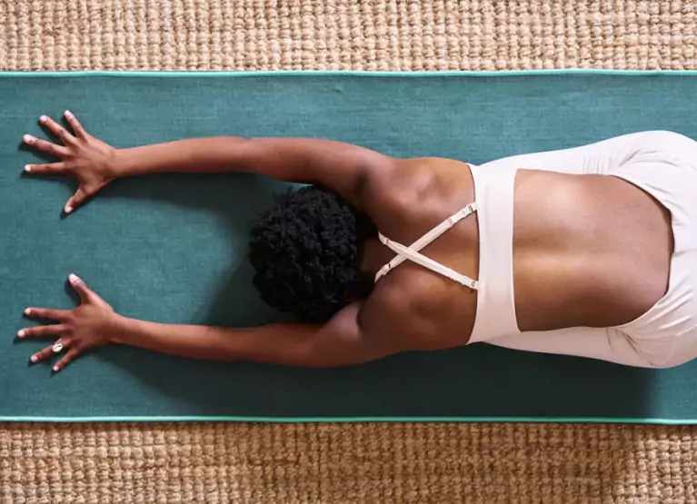 a woman holding a yoga pose