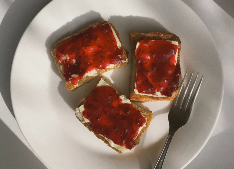 a plate of toast with jam