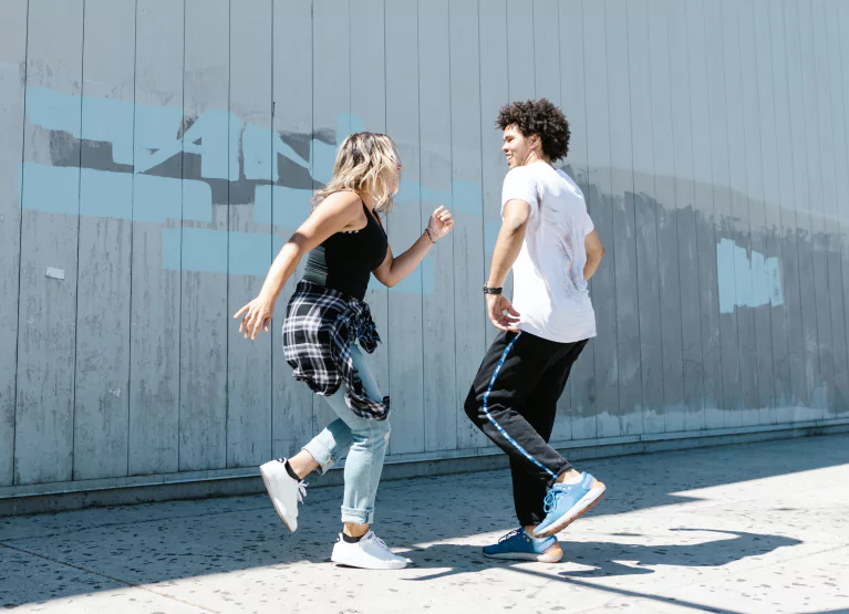 two people dancing in the street