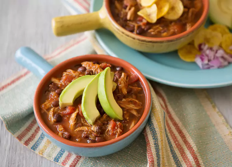 a plate with black bean plantain chili