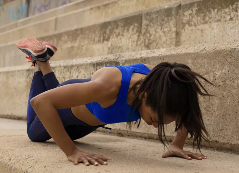 a girl doing knee push ups