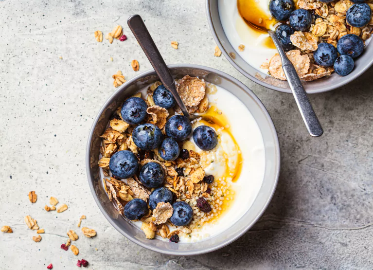 Yogurt bowl with blueberries and cereal flakes