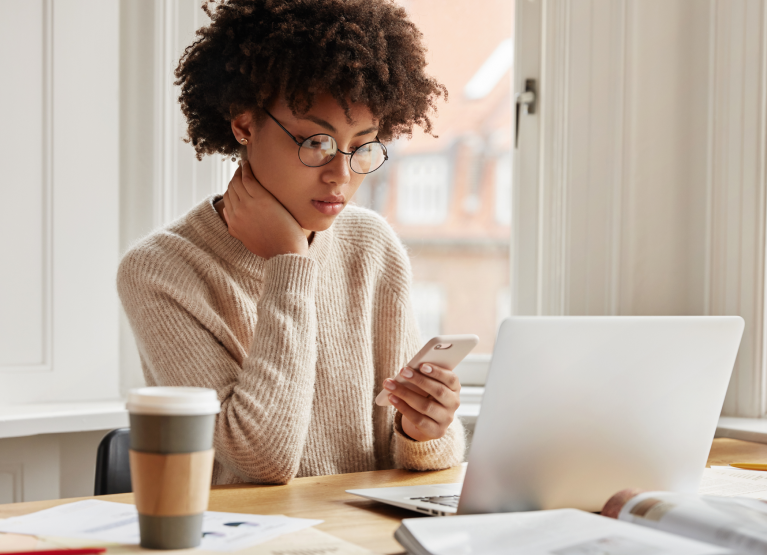 Woman checking lab results on phone