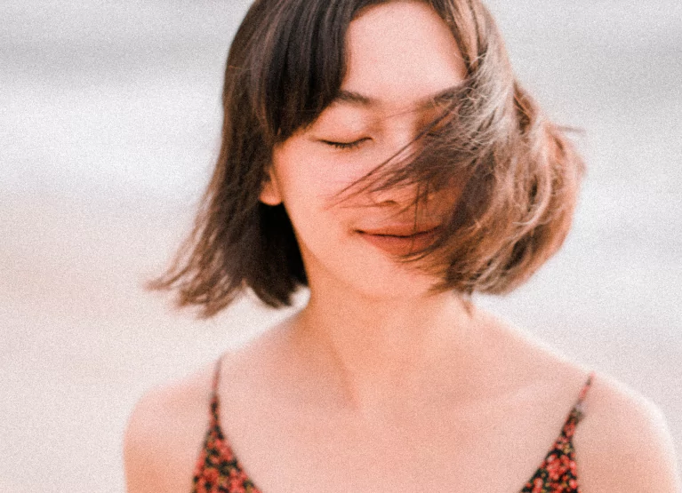 a girl feeling happy and relaxed