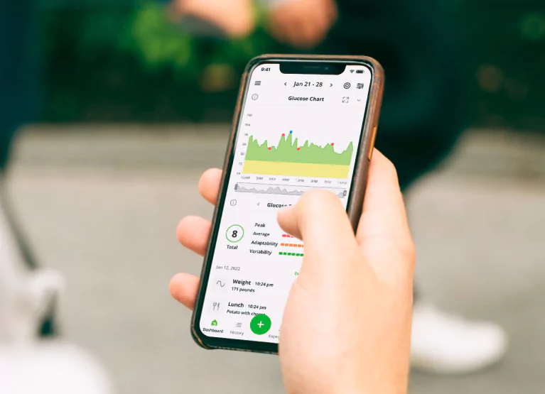 someone using the nutrisense app to check their glucose