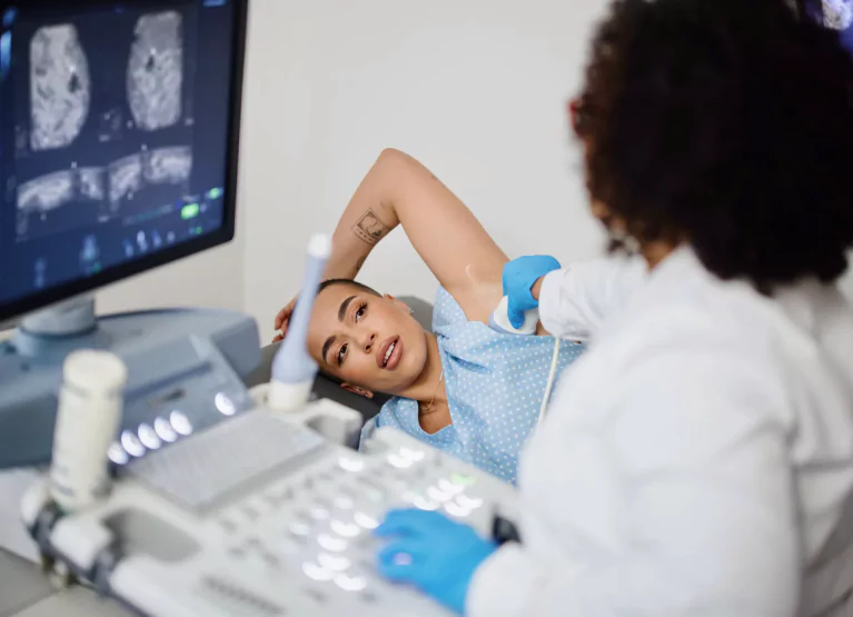 a woman getting a breast scan