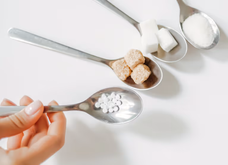 Spoons with sugar cubes and sugar free substitutes