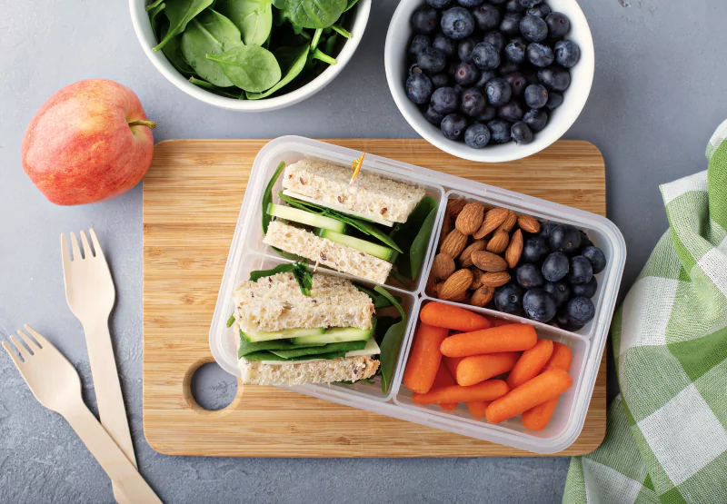 a tupperware with travel snacks