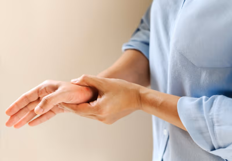Person clutching joint in pain