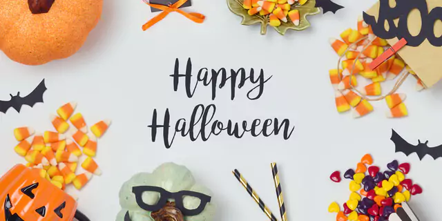 Words "Happy Halloween" among candies