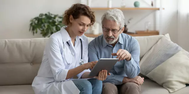 a doctor explaining a test result to an older patient