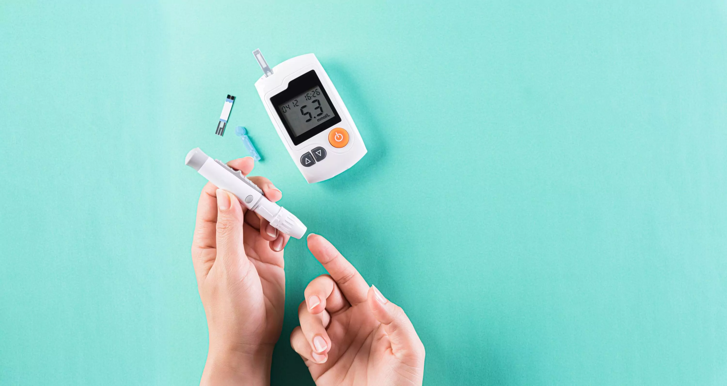a person using finger prick method to test their glucose level
