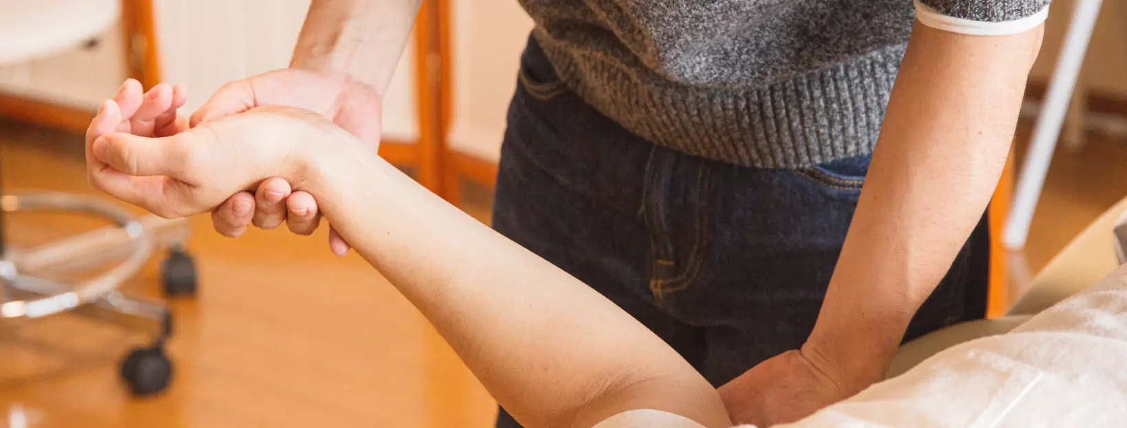 a doctor checking arm and elbow nerve function
