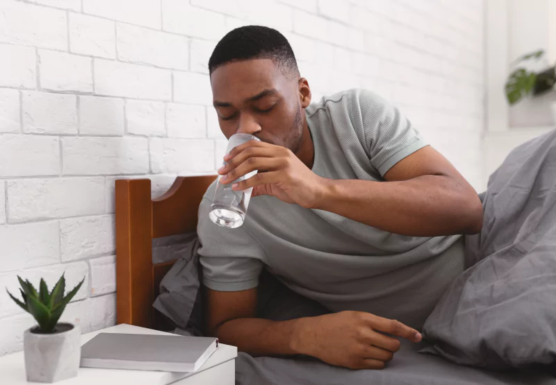 Person drinking glass of water