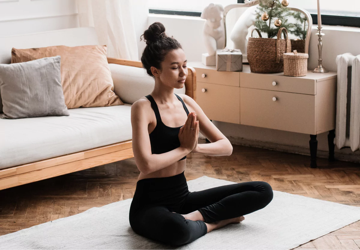 a girl doing yoga at home