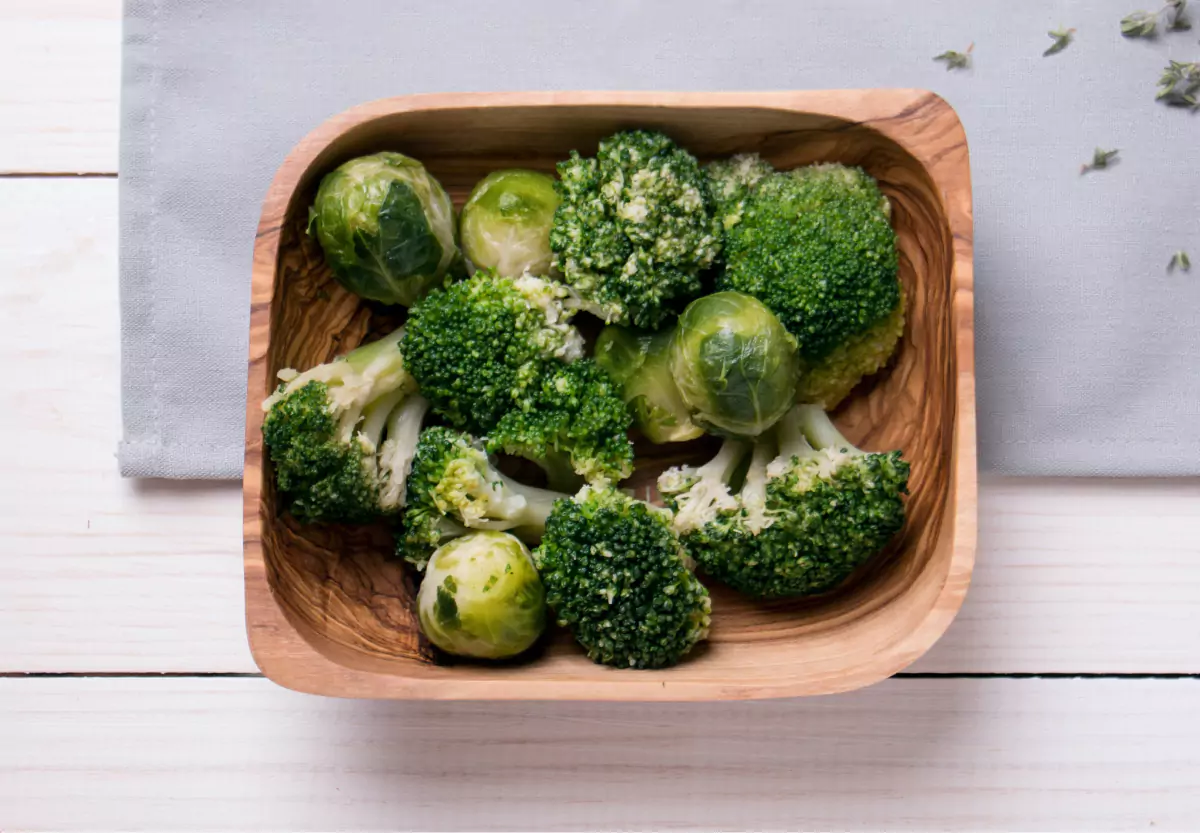 a plate of broccoli and brussels sprouts