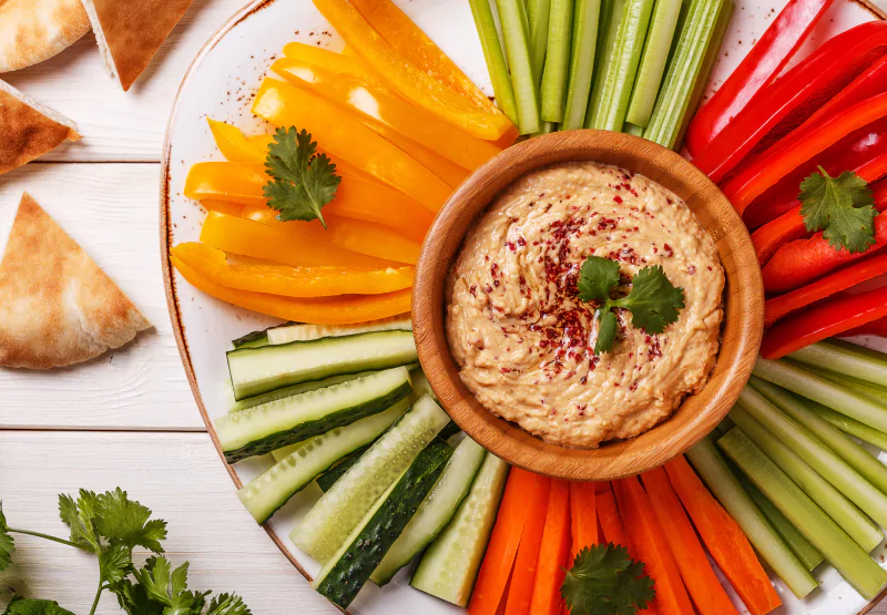 a plate of veggies and baba ganoush