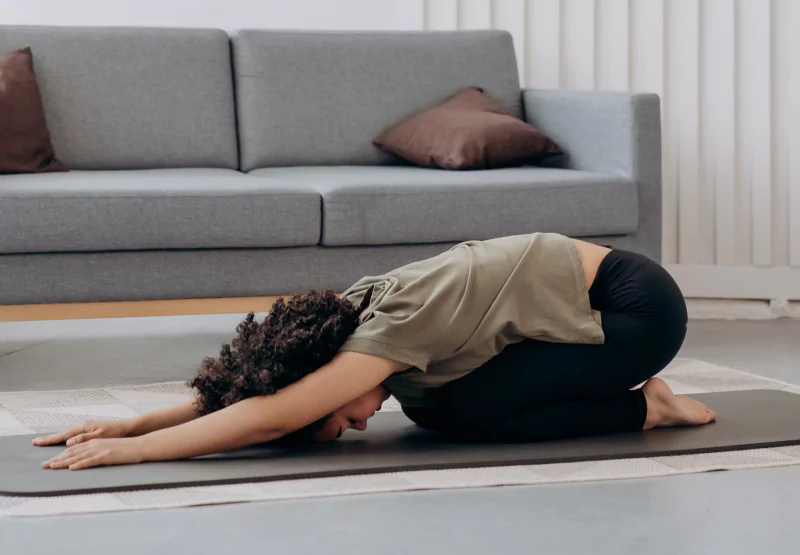 someone doing a yoga pose in their living room