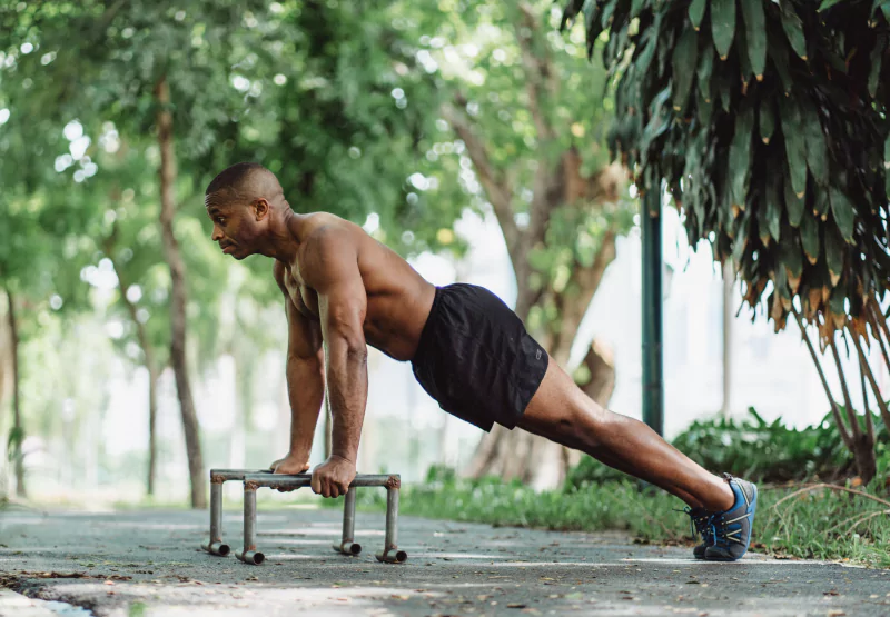 a man doing a plank outside