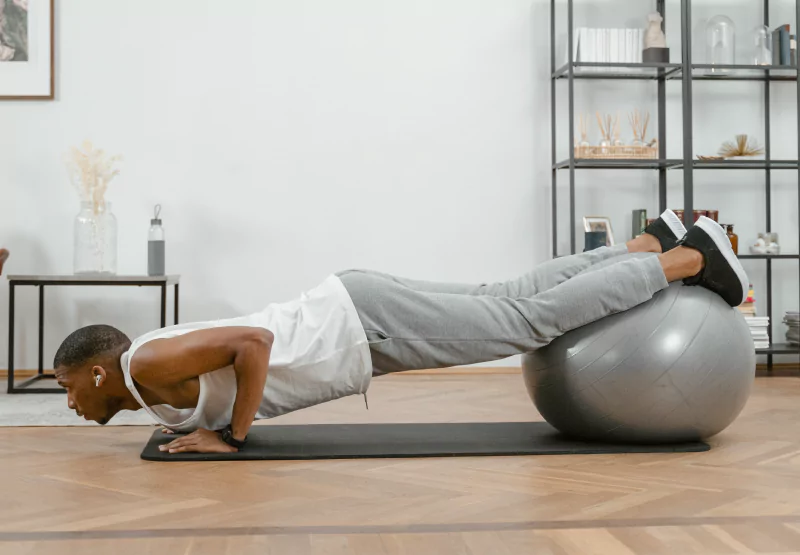 a man doing a foot-elevated push up