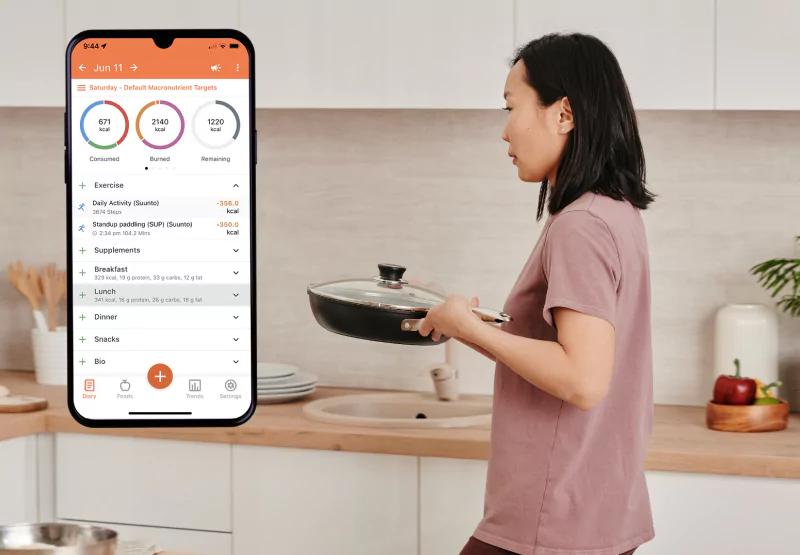 the Cronometer app and a woman cooking