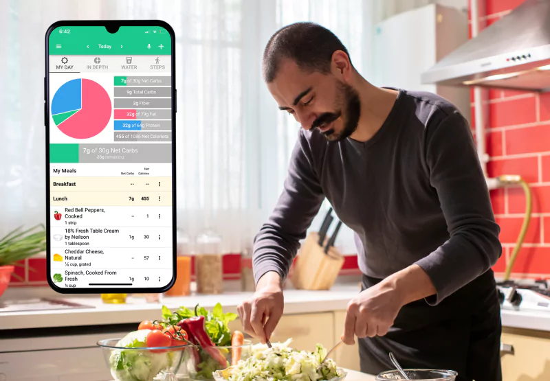 the carb manager app and a man cutting veggies